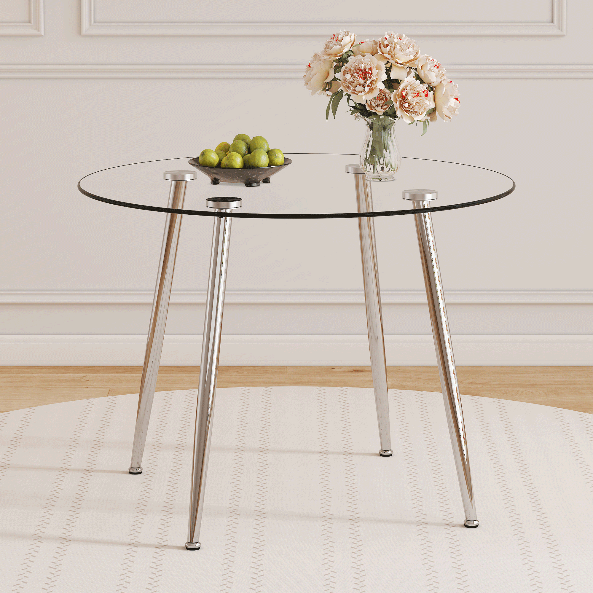 39.7-inch diameter circular dining table: transparent glass paired with silver table legs, showcasing an elegant style and fashionable restaurant furniture. 39.7-inch diameter circular dining table: transparent glass paired with silver table legs, showcasing an elegant style and fashionable restaurant furniture.